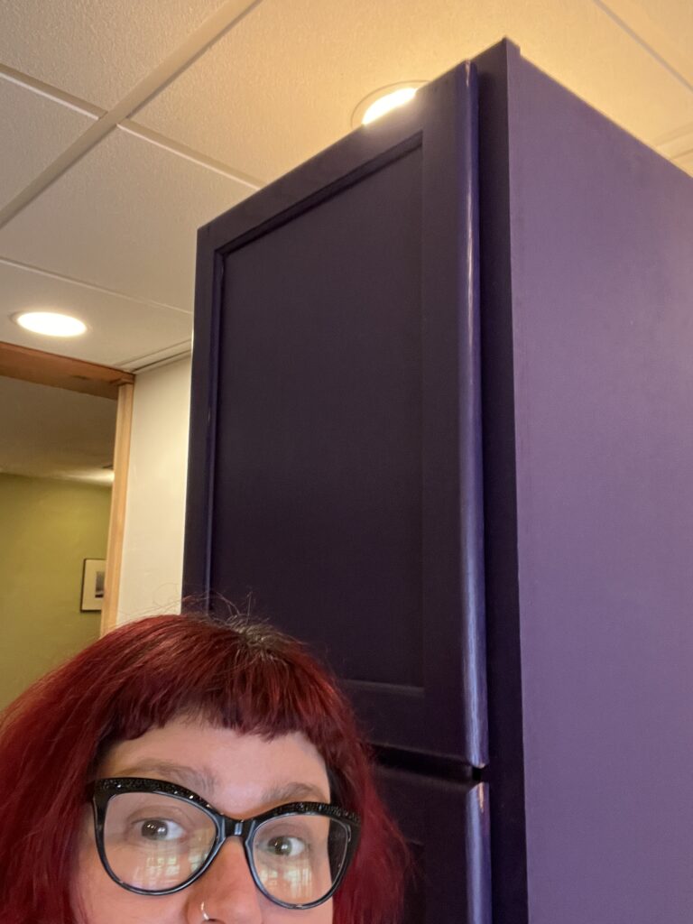 Bridget and a large purple film drying cabinet